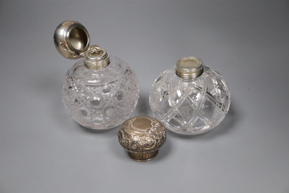 A Victorian silver mounted cut glass scent bottle, 12cm and an Edwardian silver mounted cut glass scent bottle.